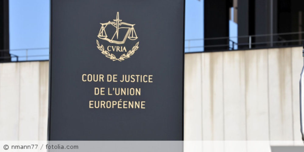 A sign with the emblem of the Court of Justice of the European Union.