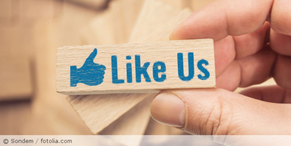 Bauklotz mit der Aufschrift "Like US".