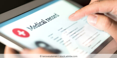 A medical record bein read on a tablet.