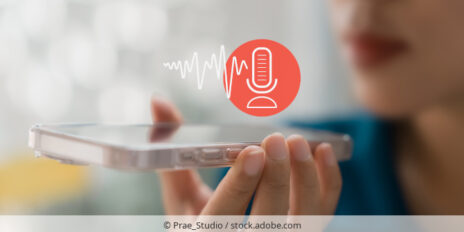 Woman recording a voice memo on a smartphone.