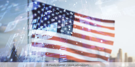 Flag of the US in front of a skyline with a data overlay.